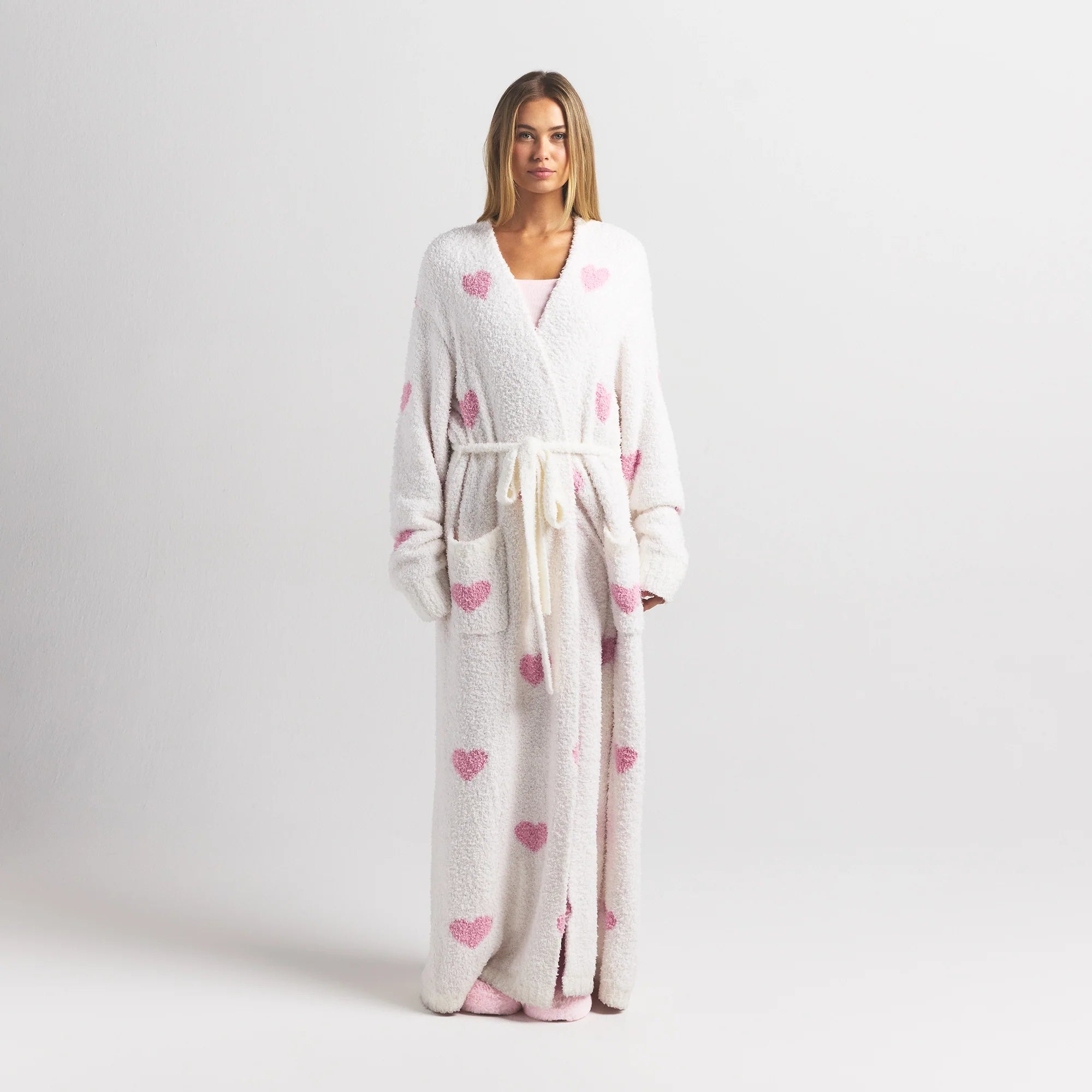 COZY KNIT UNISEX ROBE | IVORY SPACED HEARTS ON A MODEL FRONT VIEW @ | FOCUS: 0.0, 1.0, 0.9