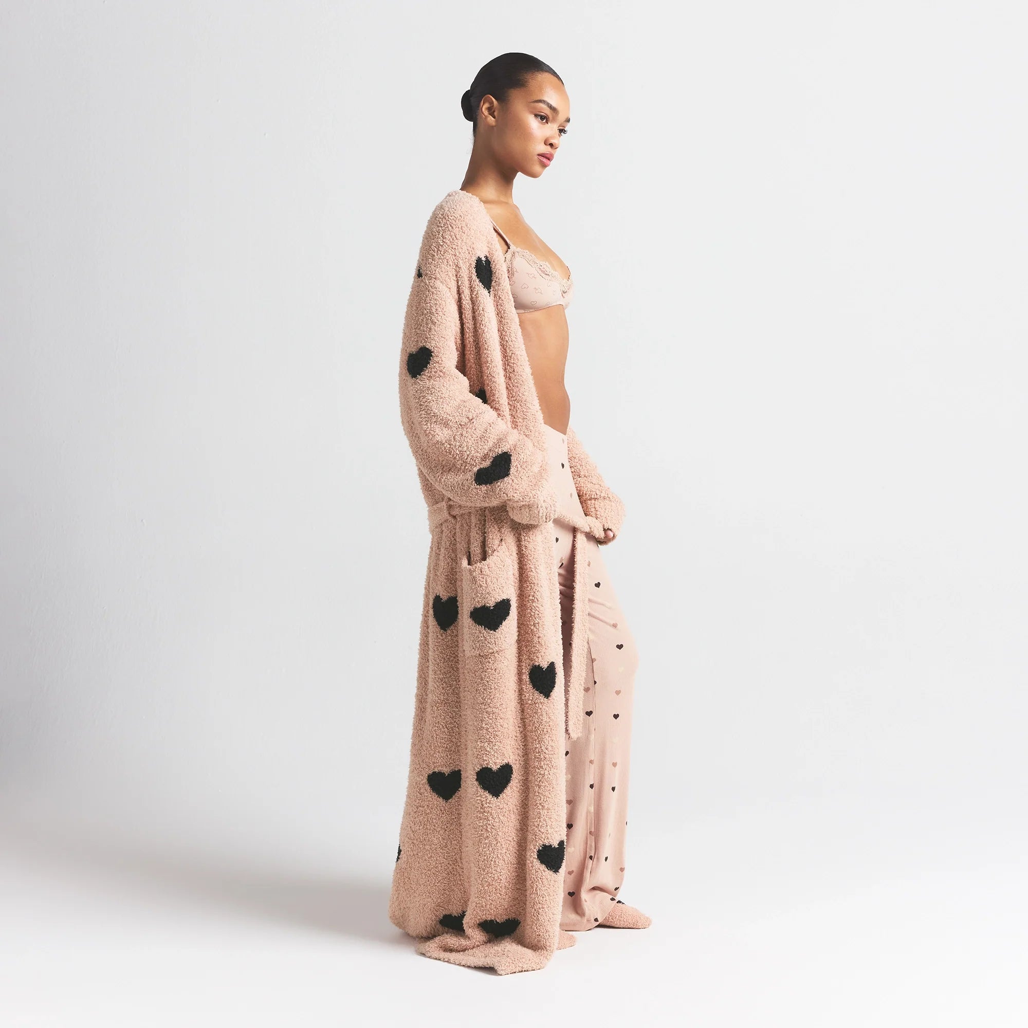 COZY KNIT UNISEX ROBE | MICA SPACED HEARTS ON A MODEL SIDE VIEW @ | FOCUS: 0.0, 1.0, 0.9