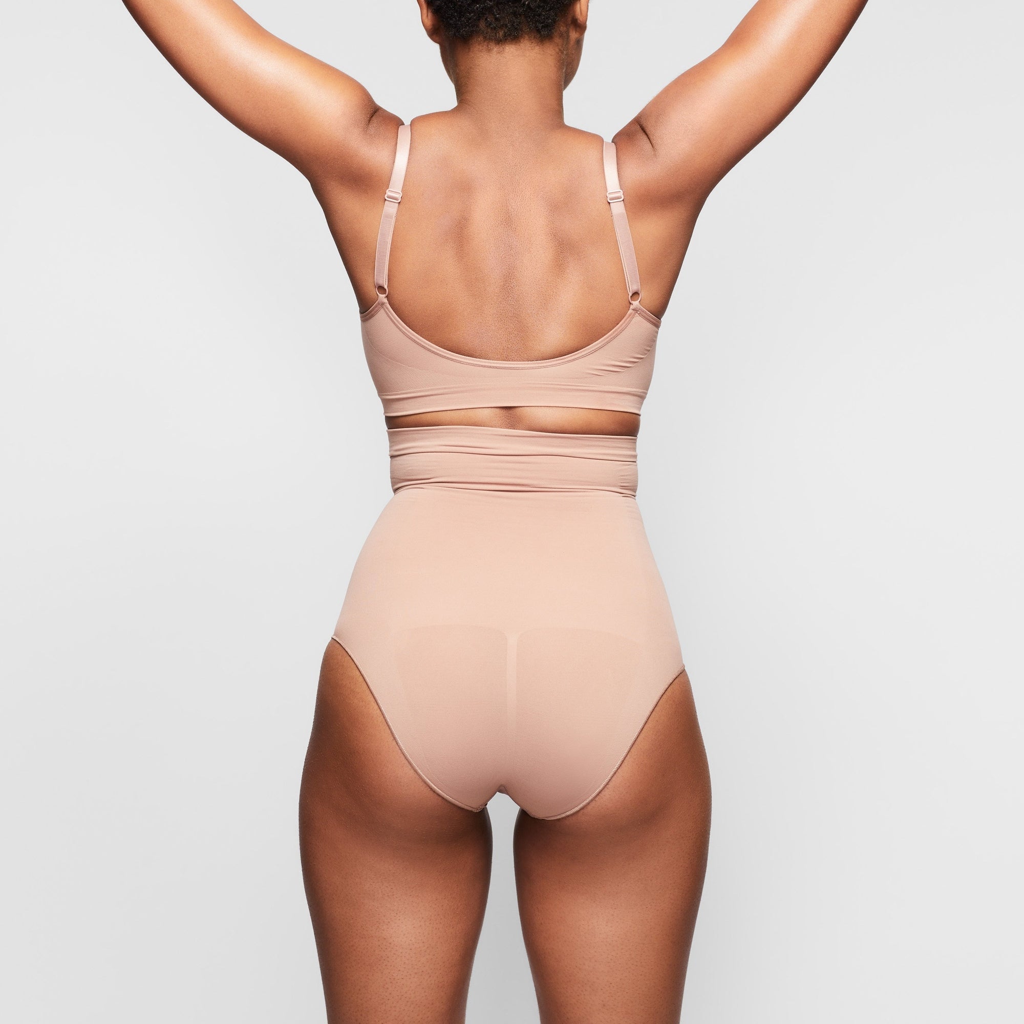 SEAMLESS SCULPT HIGH-WAISTED BRIEF ON A MODEL BACK VIEW