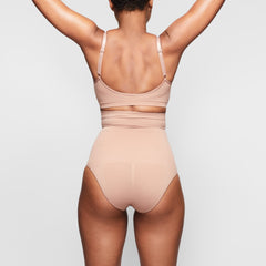 SEAMLESS SCULPT HIGH-WAISTED BRIEF ON A MODEL BACK VIEW
