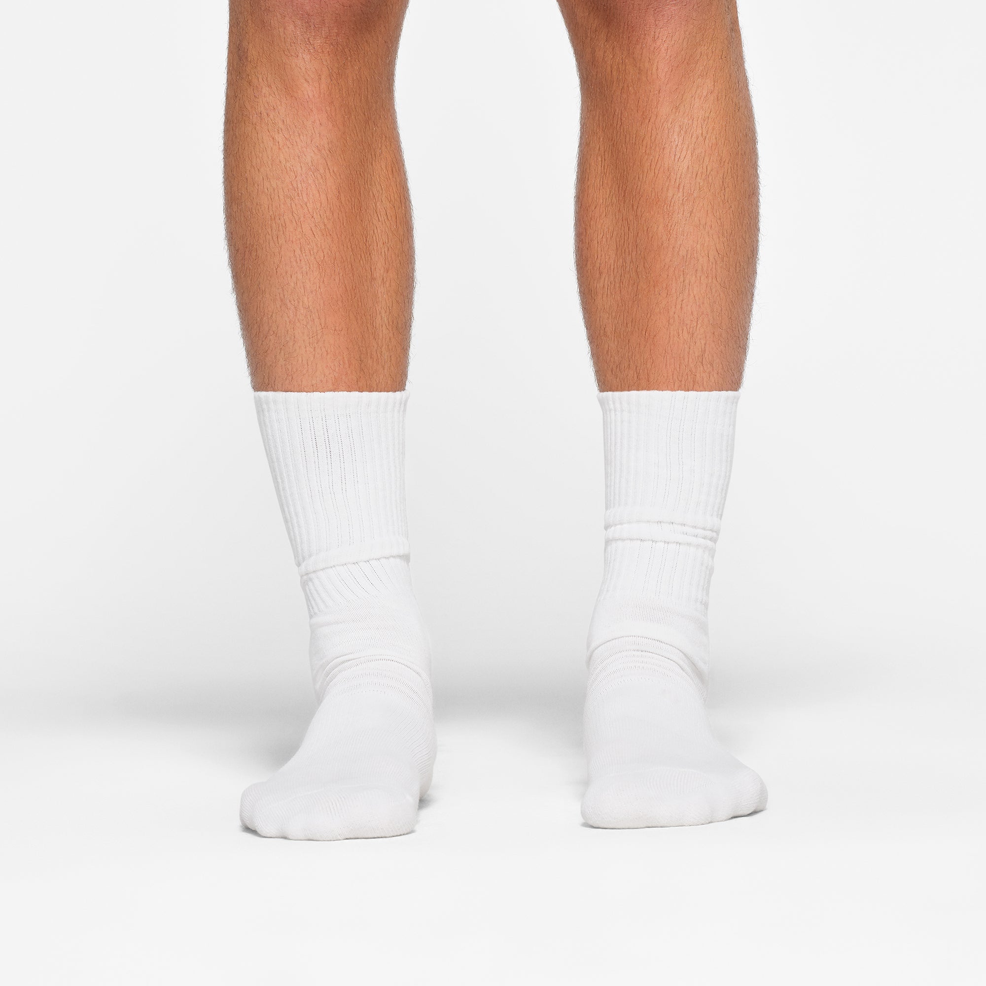 MENS TUBE CREW SOCK 3-PACK WORN BY A MODEL IN FRONT VIEW