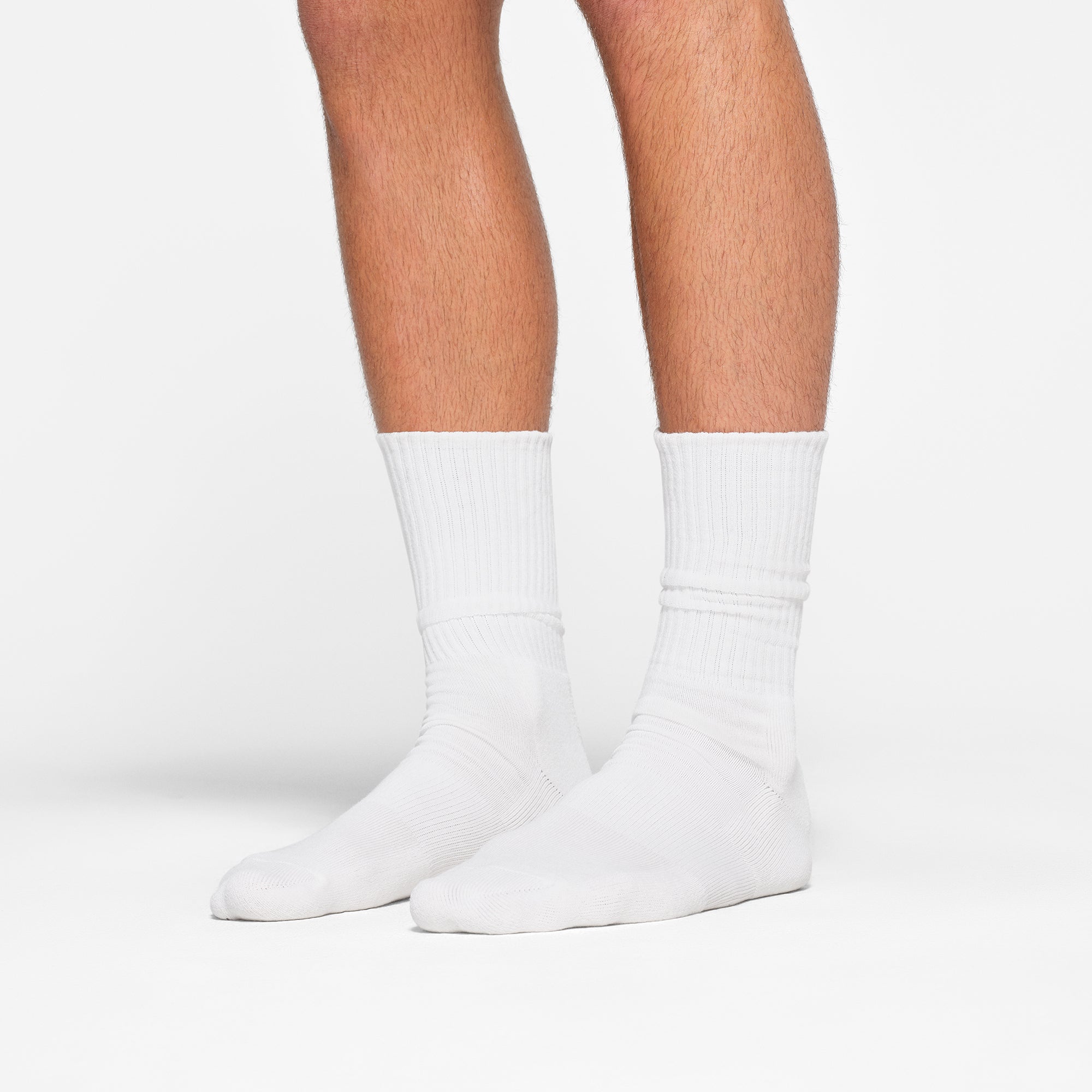 MENS TUBE CREW SOCK 3-PACK WORN BY A MODEL IN SIDE VIEW