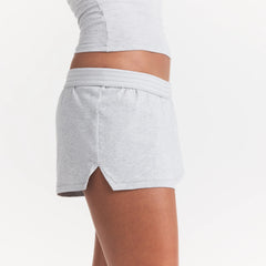 COTTON JERSEY LOOSE SHORT | LIGHT HEATHER GREY ON A MODEL SIDE VIEW @ | FOCUS: 0.0, 1.0, 0.9