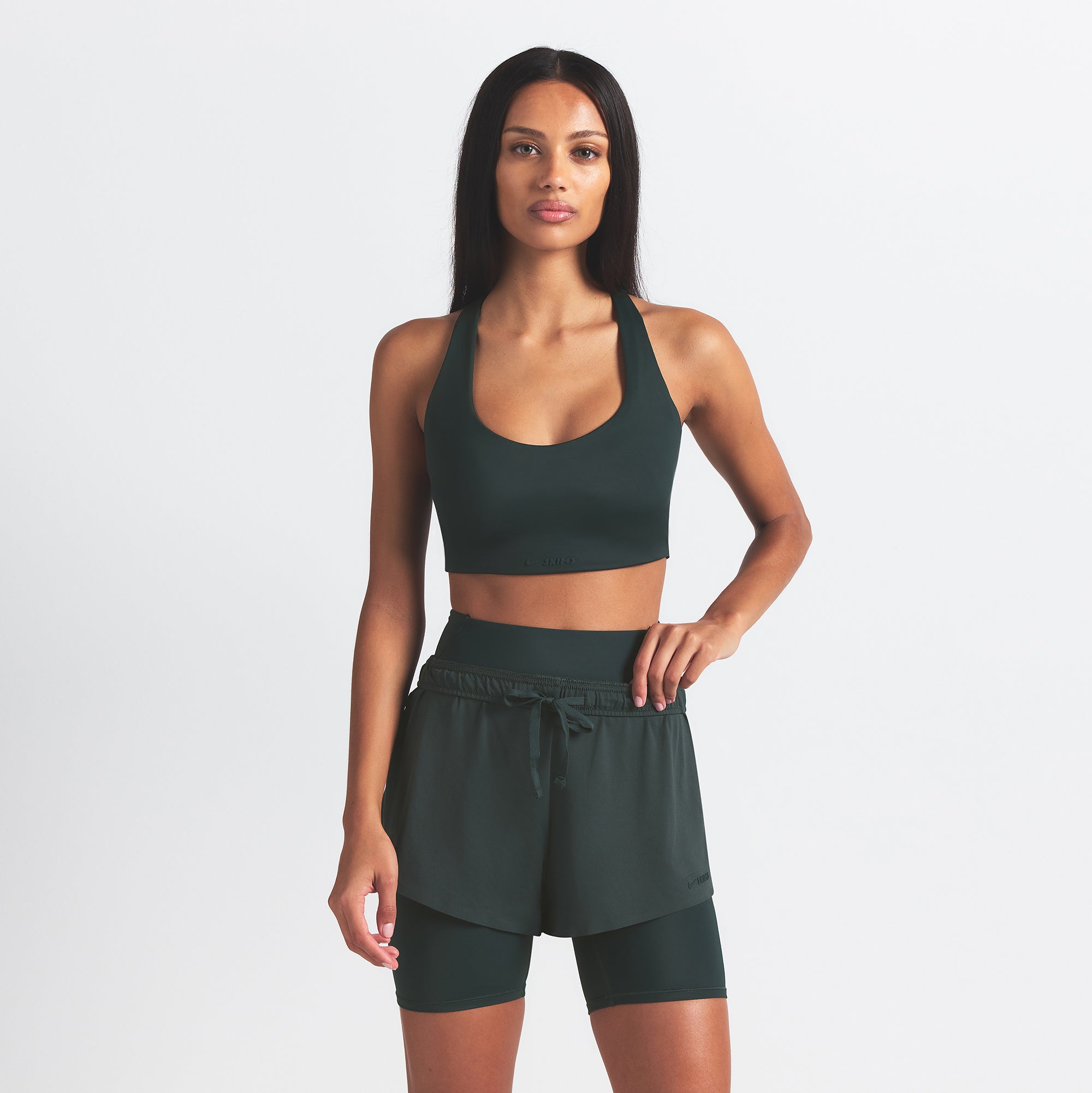 NikeSKIMS AIRY MINI SHORT | DARK TEAL ON A MODEL SIDE VIEW @ | FOCUS: 0.0, 1.0, 0.9