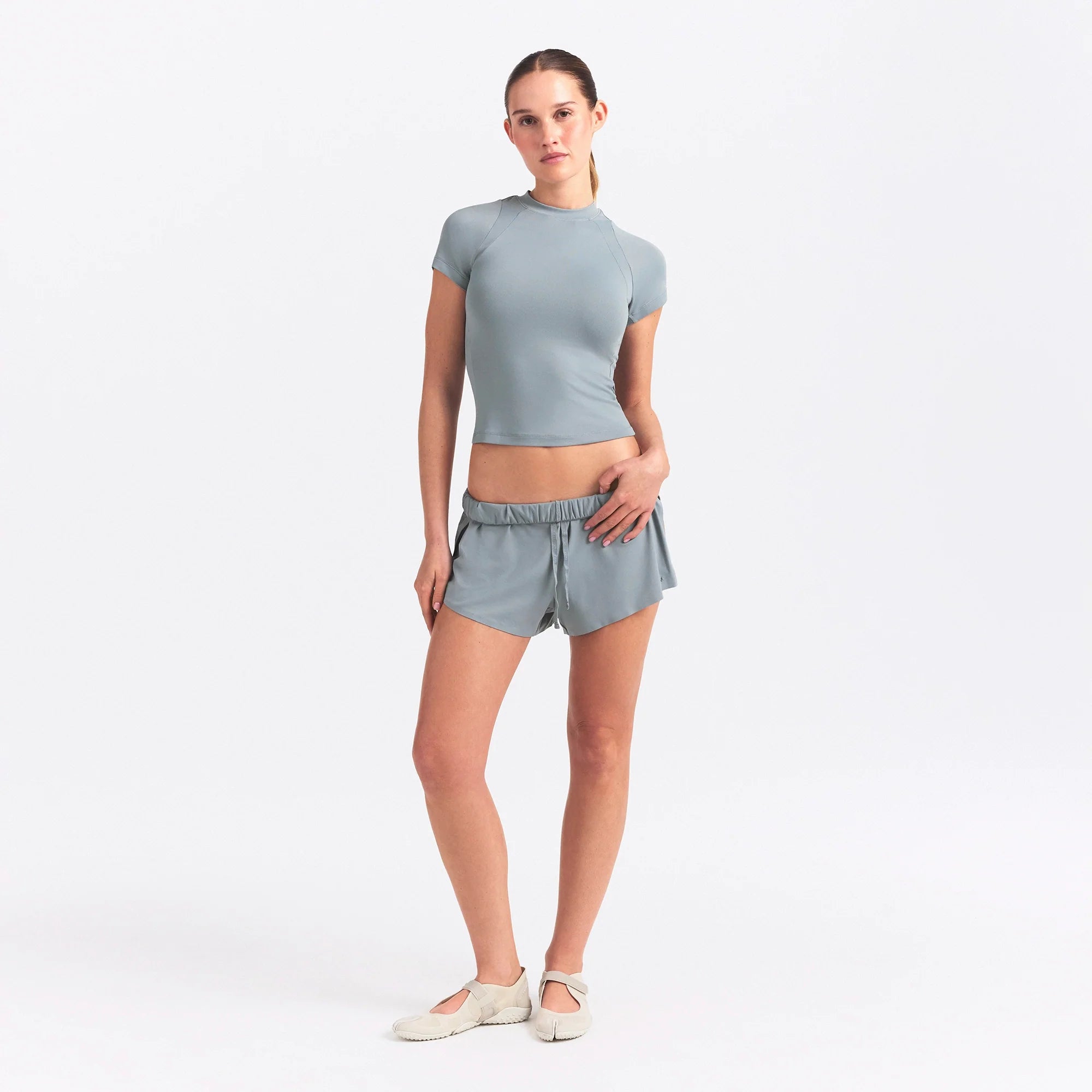 NikeSKIMS AIRY MINI SHORT | WASHED PACIFIC ON A MODEL FRONT VIEW @ | FOCUS: 0.0, 1.0, 0.9