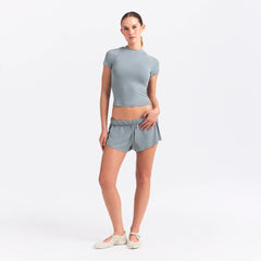 NikeSKIMS AIRY MINI SHORT | WASHED PACIFIC ON A MODEL FRONT VIEW @ | FOCUS: 0.0, 1.0, 0.9