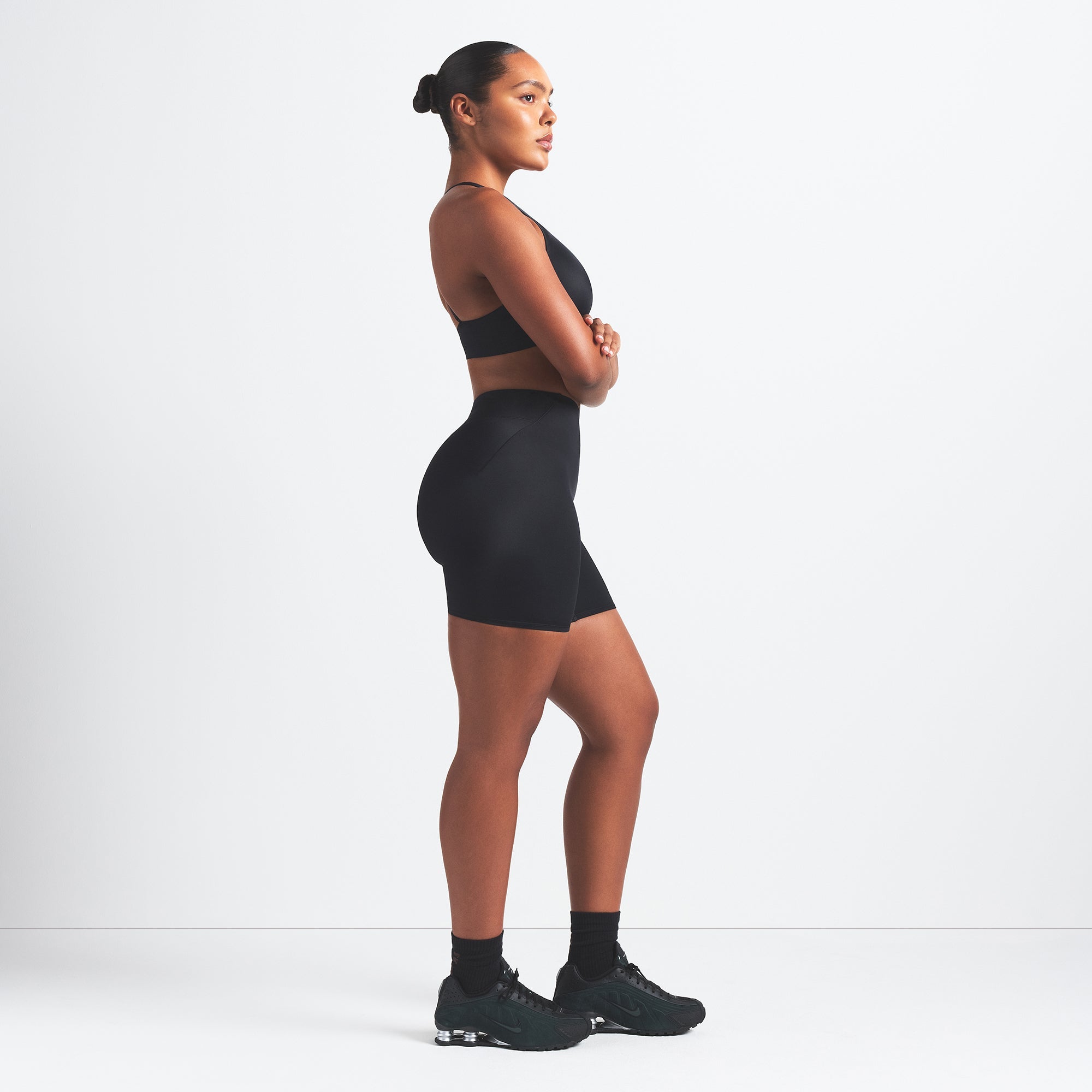 NikeSKIMS SHINE BONDED WAIST 5" BIKER SHORT | OBSIDIAN ON A MODEL FRONT VIEW