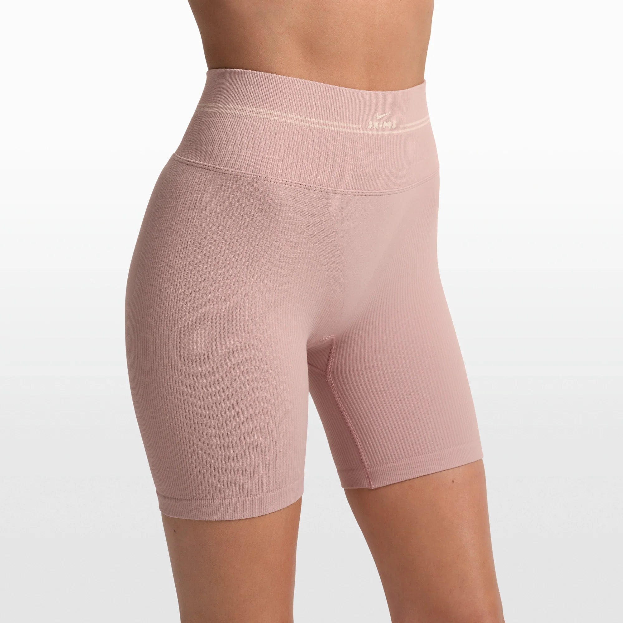 NikeSKIMS RIBBED SEAMLESS 5" BIKER SHORT | HIMALAYAN/ECRU ON A MODEL FRONT VIEW @ | FOCUS: 0.0, 1.0, 0.9