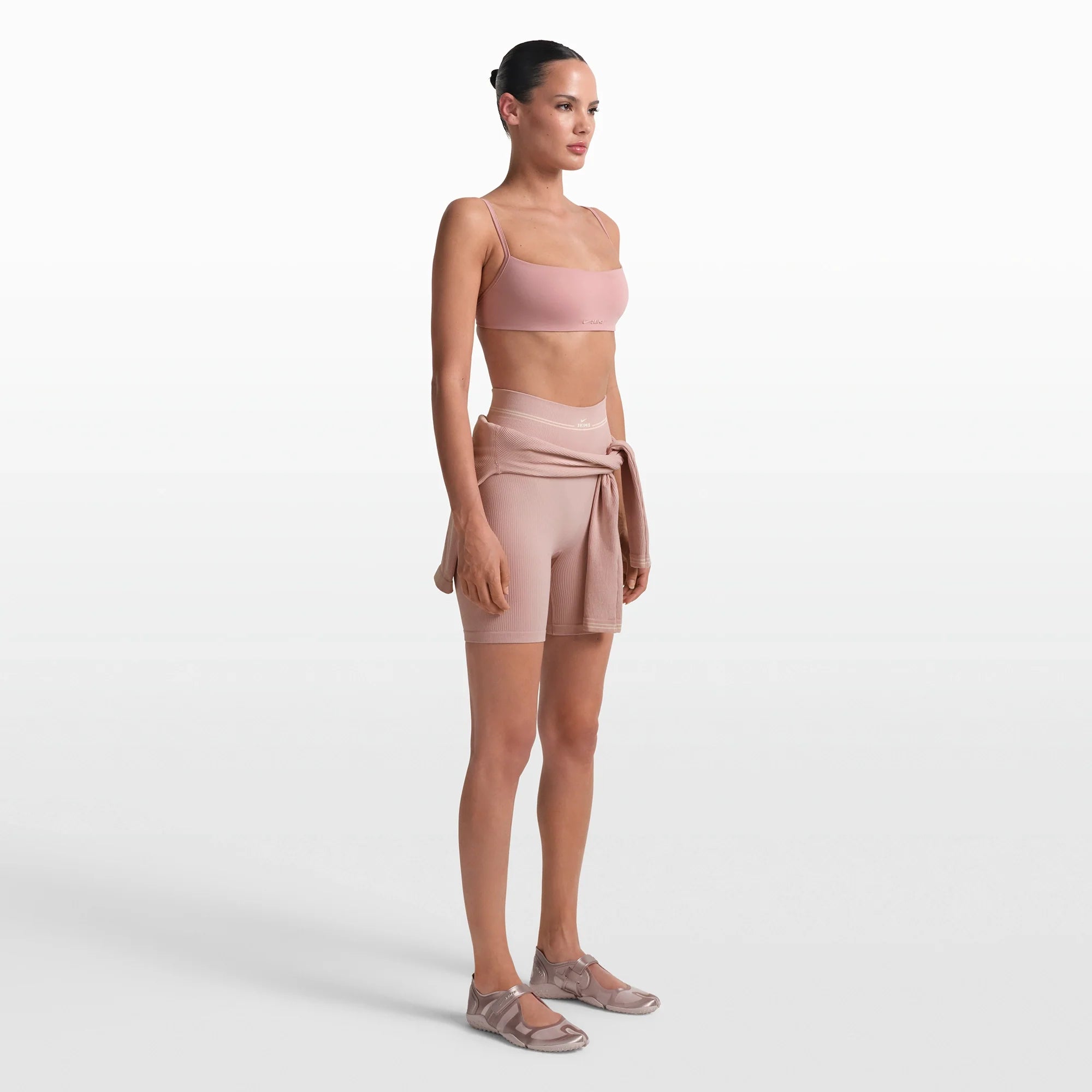 NikeSKIMS RIBBED SEAMLESS 5" BIKER SHORT | HIMALAYAN/ECRU ON A MODEL FRONT VIEW @ | FOCUS: 0.0, 1.0, 0.9