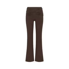 NikeSKIMS MATTE FOLDOVER SLIM FLARE LEGGING | DARK SEPIA FLAT ON A WHITE BACKGROUND | FLT