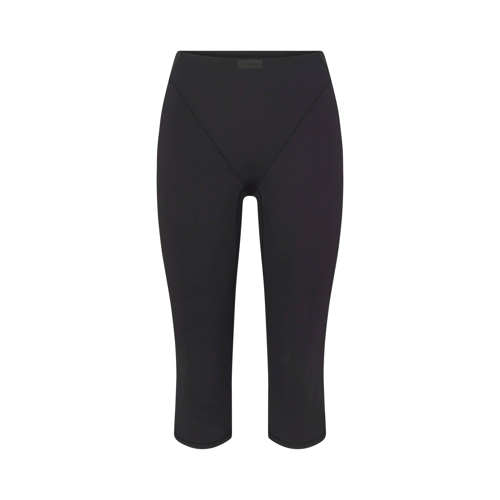 NikeSKIMS MATTE 17" V-LINE CROP LEGGING | OBSIDIAN FLAT ON A WHITE BACKGROUND | FLT
