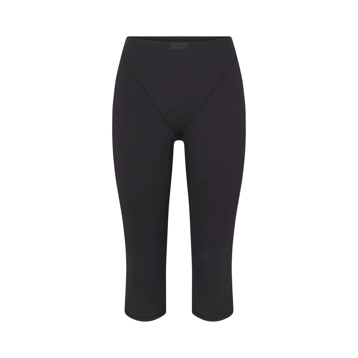 NikeSKIMS MATTE 17" V-LINE CROP LEGGING | OBSIDIAN FLAT ON A WHITE BACKGROUND | FLT