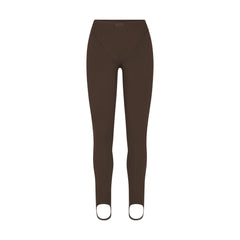 NikeSKIMS MATTE V-LINE STIRRUP LEGGING | DARK SEPIA FLAT ON A WHITE BACKGROUND | FLT