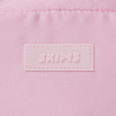 SKIMS ACCESSORIES SATIN MINI DUFFLE BAG | PEONY ADDITIONAL FABRIC DETAILS