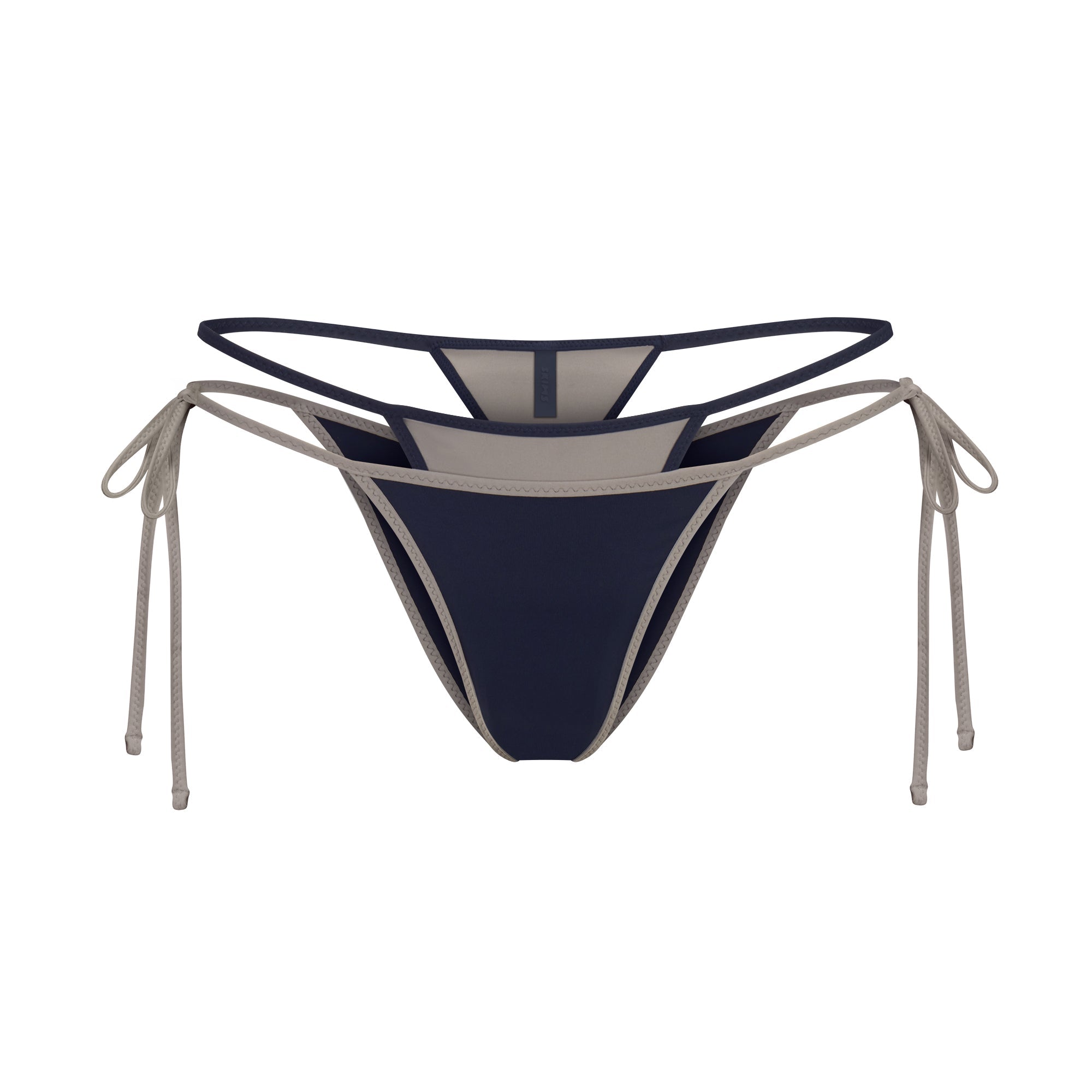 SIGNATURE SWIM LAYERED TIE SIDE BIKINI BOTTOM | NAVY CONTRAST LAYS FLAT ON A WHITE BACKGROUND | FLT