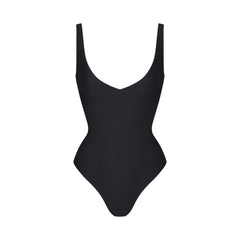 SKIMS BODY UNLINED PLUNGE THONG BODYSUIT | ONYX (SHAPEWEAR BODYSUITS, SHAPEWEAR) LAYS FLAT ON A WHITE BACKGROUND | FLT