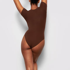 BACK VIEW OF THE FITS EVERYBODY T-SHIRT BODYSUIT ON A MODEL