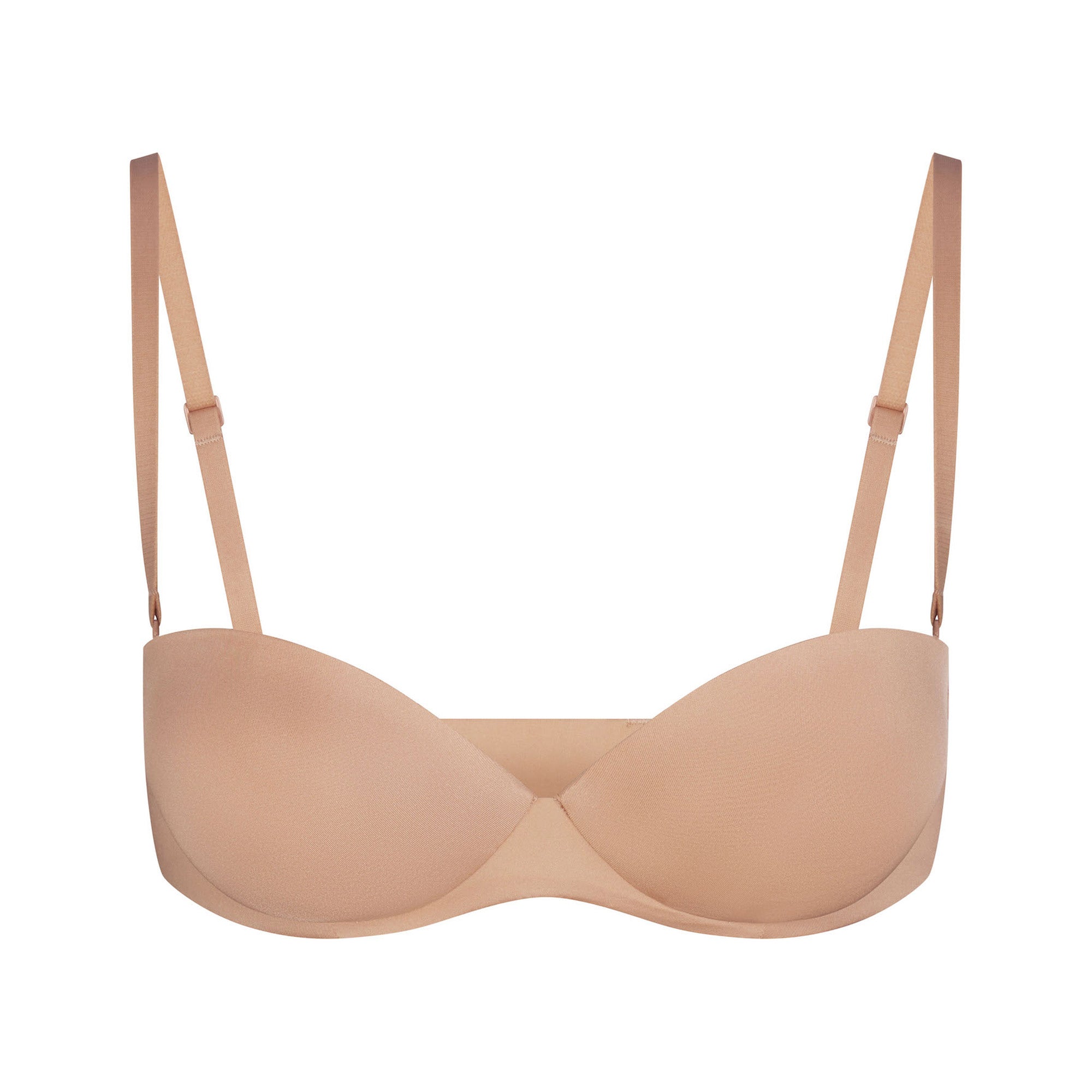 SKIMS ULTIMATE BRA STRAPLESS PUSH-UP BRA LAYS FLAT ON A WHITE BACKGROUND | FLT