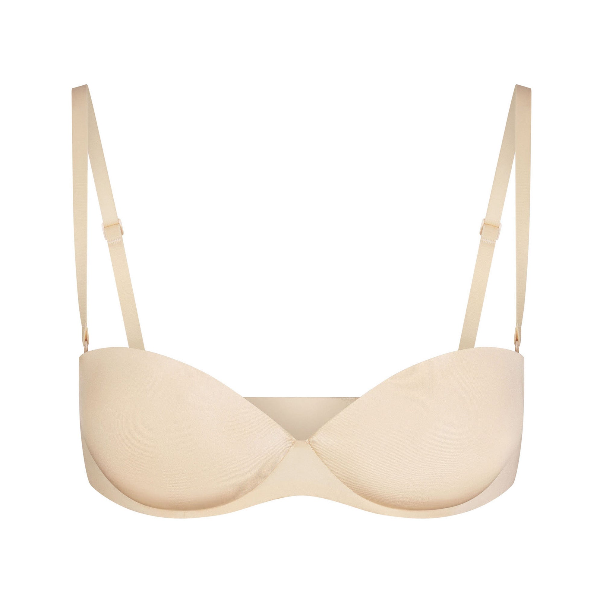 SKIMS ULTIMATE BRA STRAPLESS PUSH-UP BRA LAYS FLAT ON A WHITE BACKGROUND | FLT