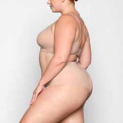 NAKED SCOOP BRA WORN BY A MODEL IN SIDE VIEW