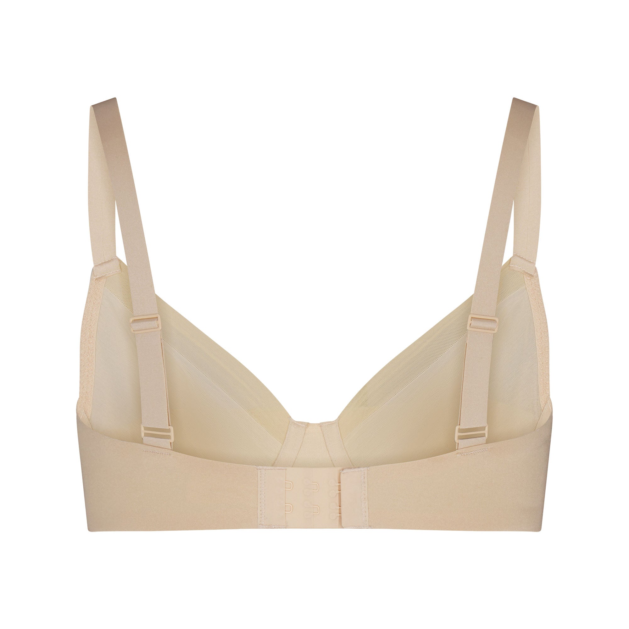 NO SHOW MOLDED UNLINED DEMI BRA LAYS FLAT ON A WHITE BACKGROUND | FLT