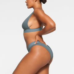 COTTON PLUNGE BRALETTE WORN BY A MODEL IN SIDE VIEW