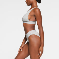 COTTON PLUNGE BRALETTE WORN BY A MODEL IN SIDE VIEW