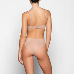 NAKED PLUNGE BRA ON A MODEL BACK VIEW
