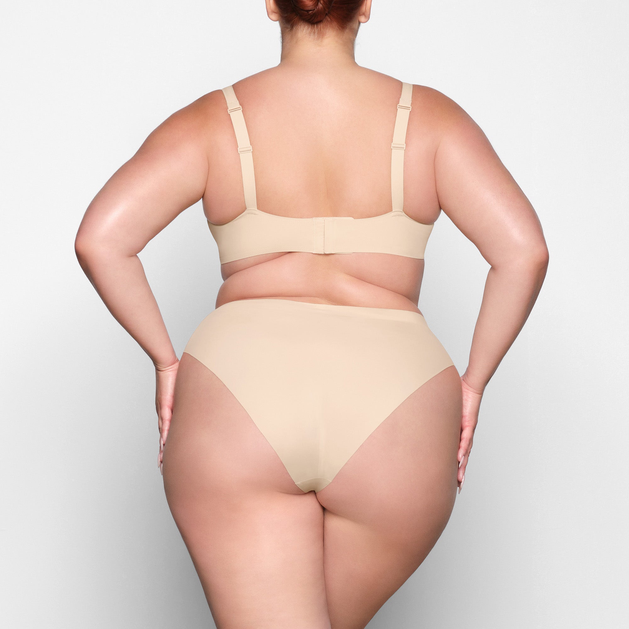 NAKED PLUNGE BRA ON A MODEL BACK VIEW