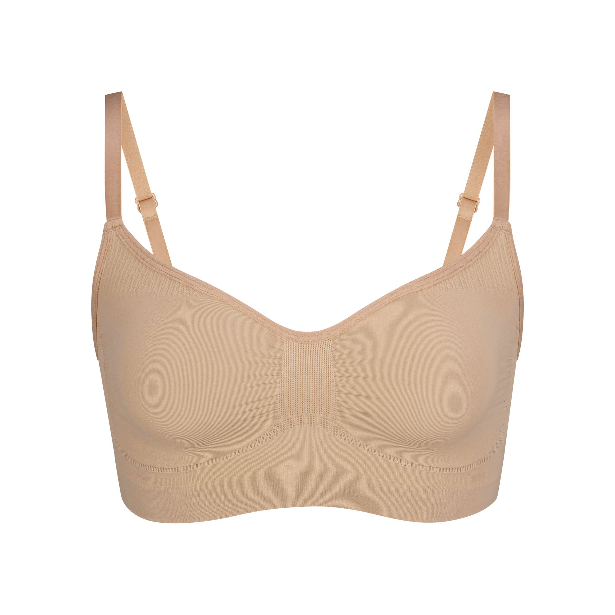 SEAMLESS SCULPT BRALETTE | CLAY (SHAPEWEAR BRALETTES, BRAS) LAYS FLAT ON A WHITE BACKGROUND | FLT