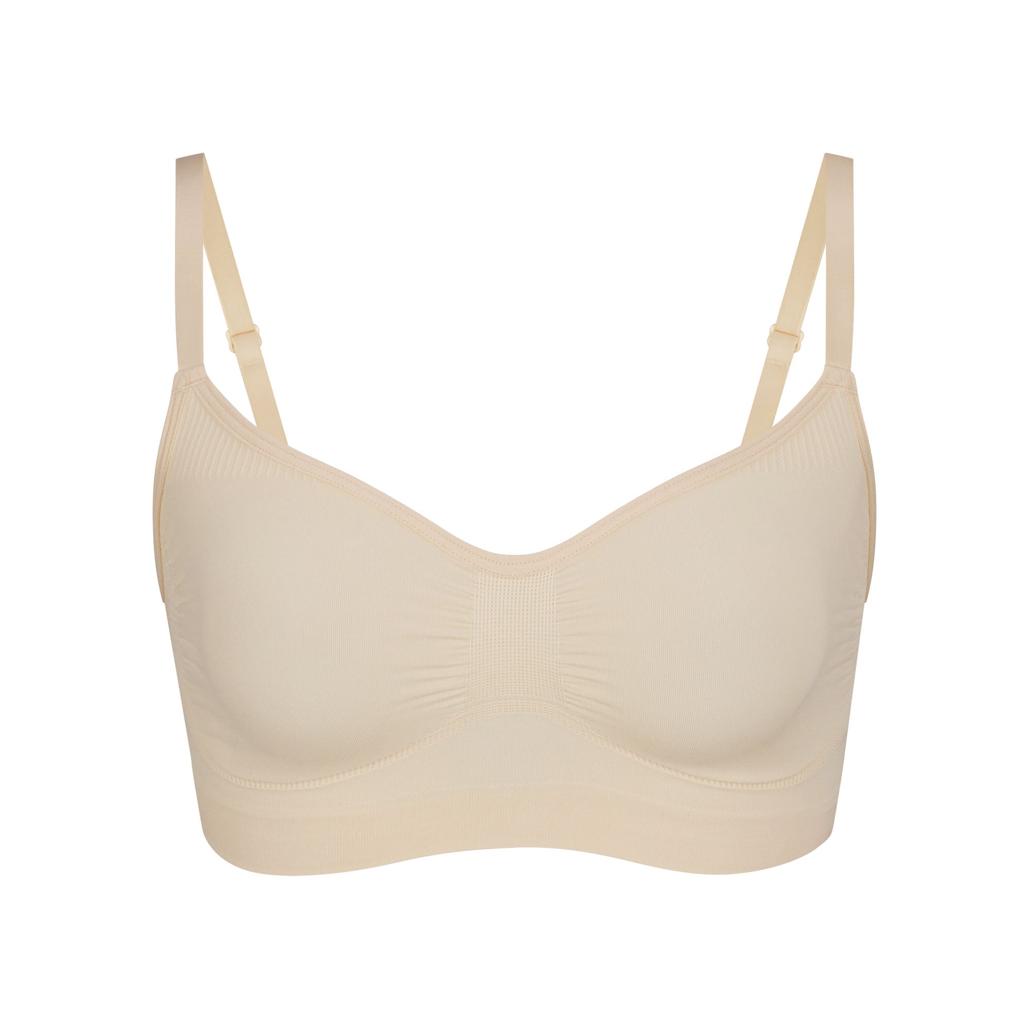 SEAMLESS SCULPT BRALETTE | SAND (SHAPEWEAR BRALETTES, BRAS) LAYS FLAT ON A WHITE BACKGROUND | FLT