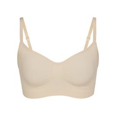 SEAMLESS SCULPT BRALETTE | SAND (SHAPEWEAR BRALETTES, BRAS) LAYS FLAT ON A WHITE BACKGROUND | FLT