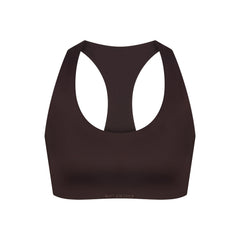 NikeSKIMS SHINE RACER BACK BRA | PHOENIX FLAT ON A WHITE BACKGROUND | FLT