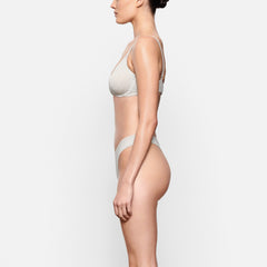 COTTON JERSEY T-SHIRT BRA WORN BY A MODEL IN SIDE VIEW