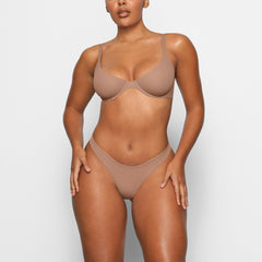 FITS EVERYBODY SCOOP PLUNGE BRA WORN BY A MODEL IN FRONT VIEW