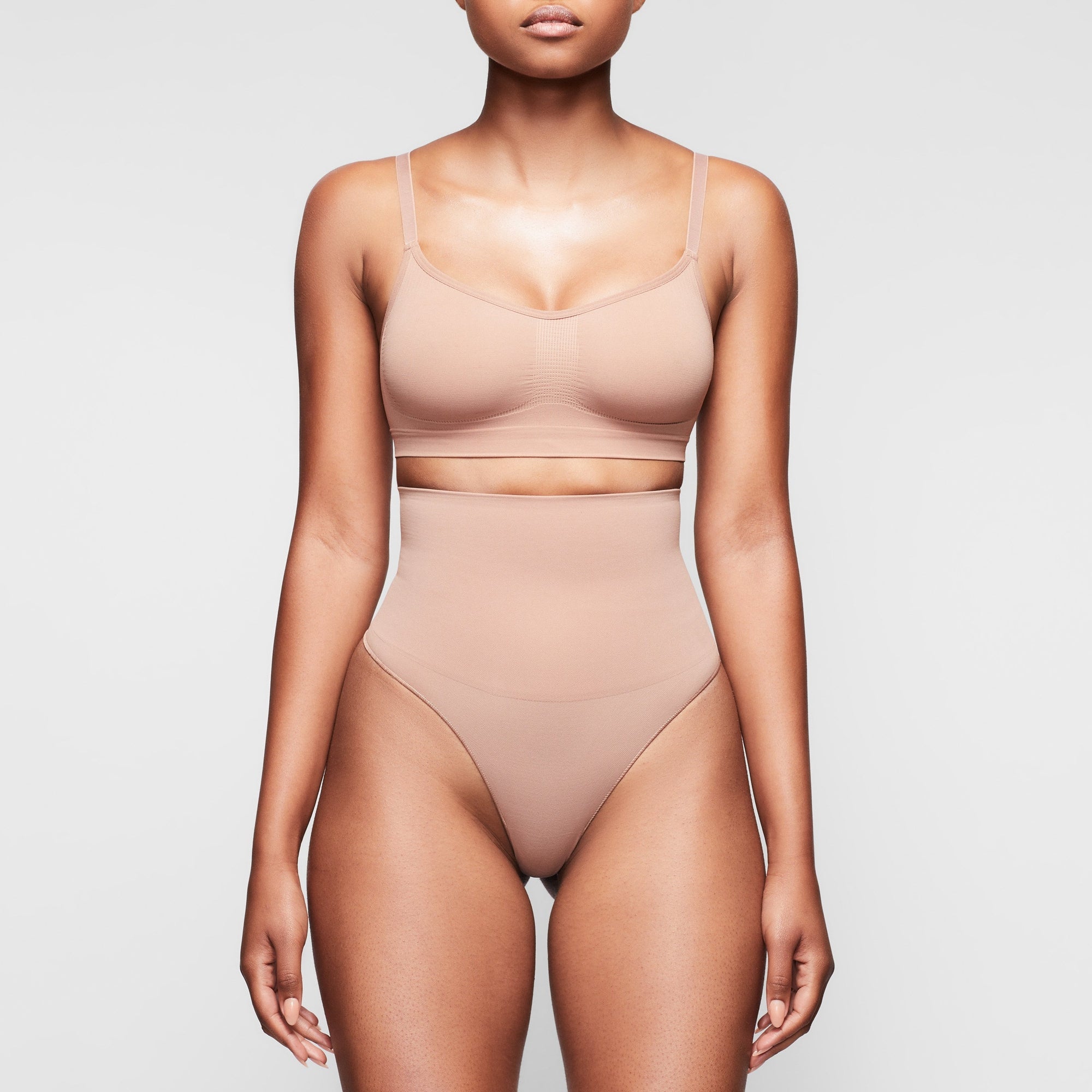 SEAMLESS SCULPT BRALETTE WORN BY A MODEL IN FRONT VIEW, XL