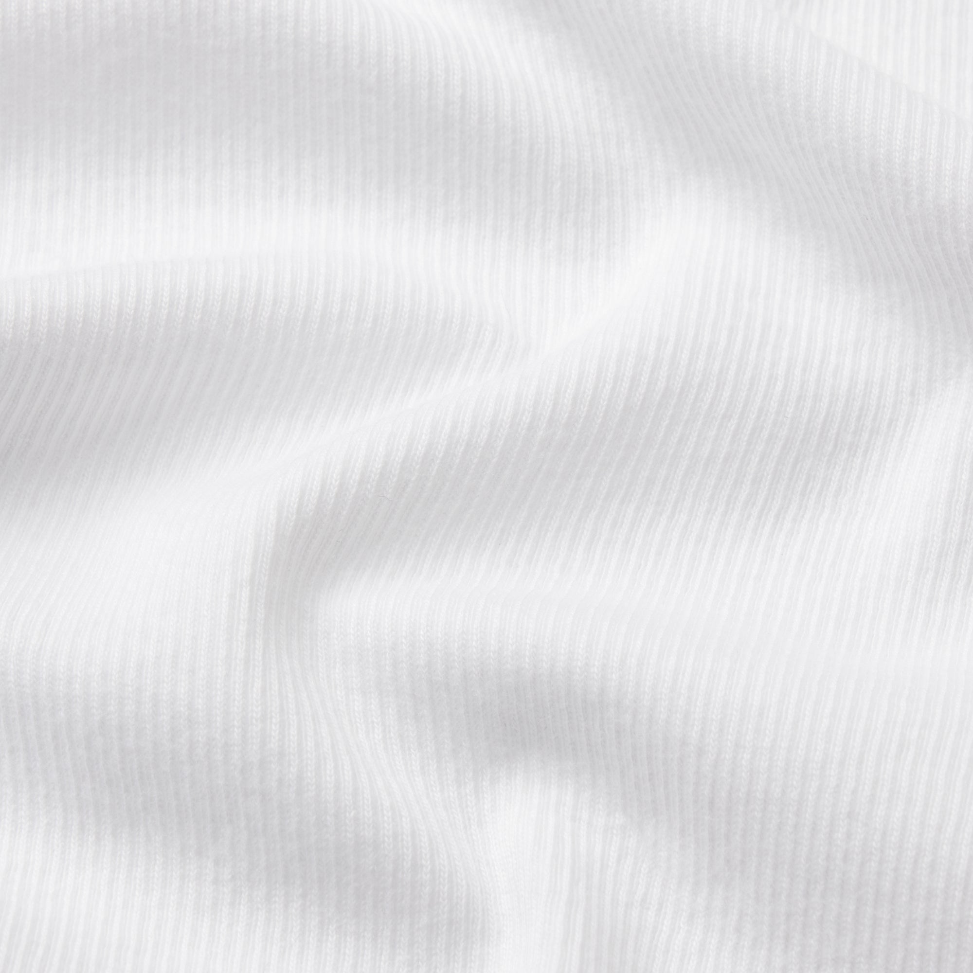 SKIMS COTTON RIB MENS HENLEY | CHALK & LAYS FLAT ON A WHITE BACKGROUND | FLT