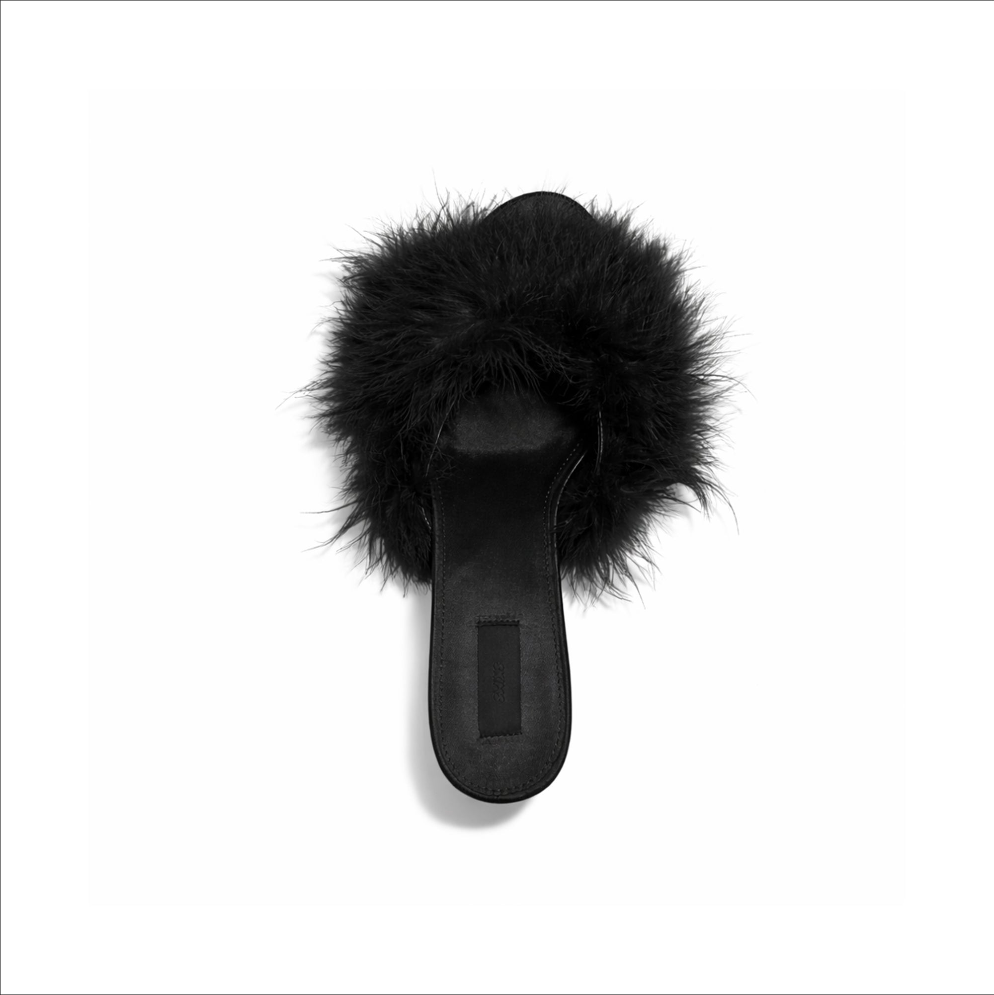 FEATHER KITTEN HEEL | ONYX FLAT ON A WHITE BACKGROUND