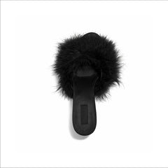 FEATHER KITTEN HEEL | ONYX FLAT ON A WHITE BACKGROUND