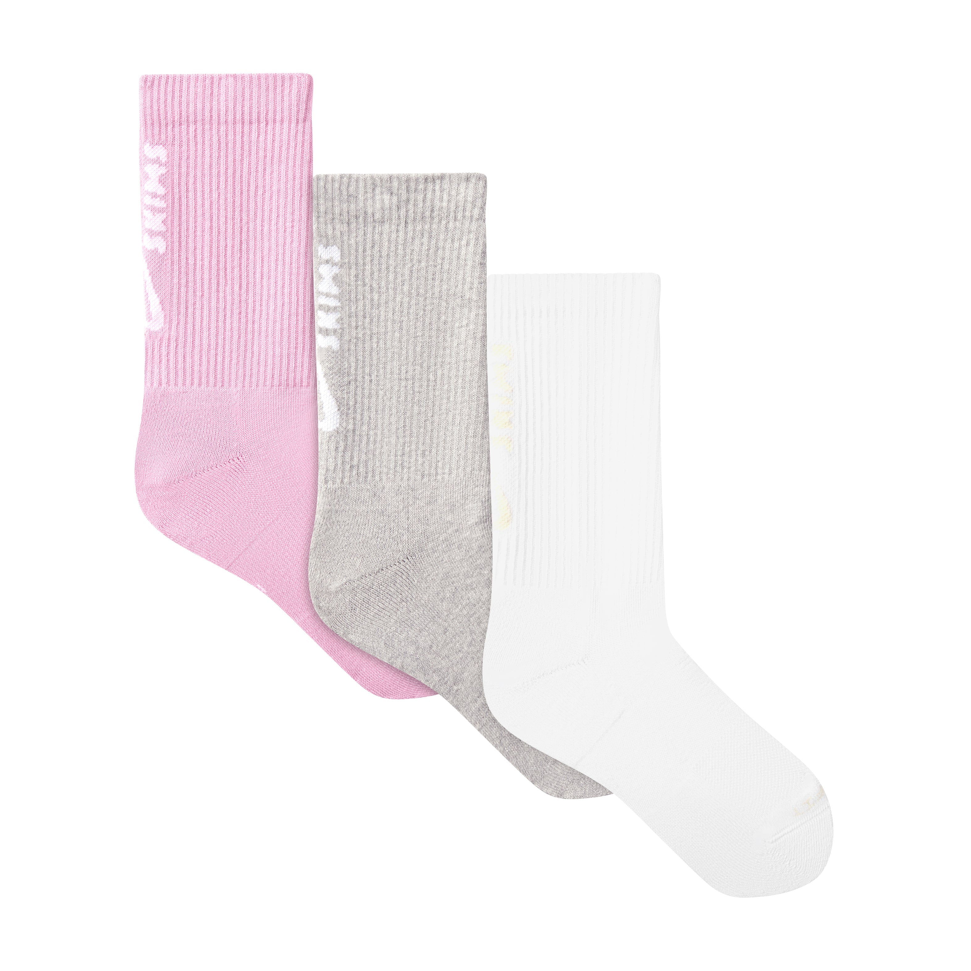 NikeSKIMS ACCESSORIES DRI-FIT CREW SOCK 3-PACK | BUBBLE GUM MULTI LAYS FLAT ON A WHITE BACKGROUND