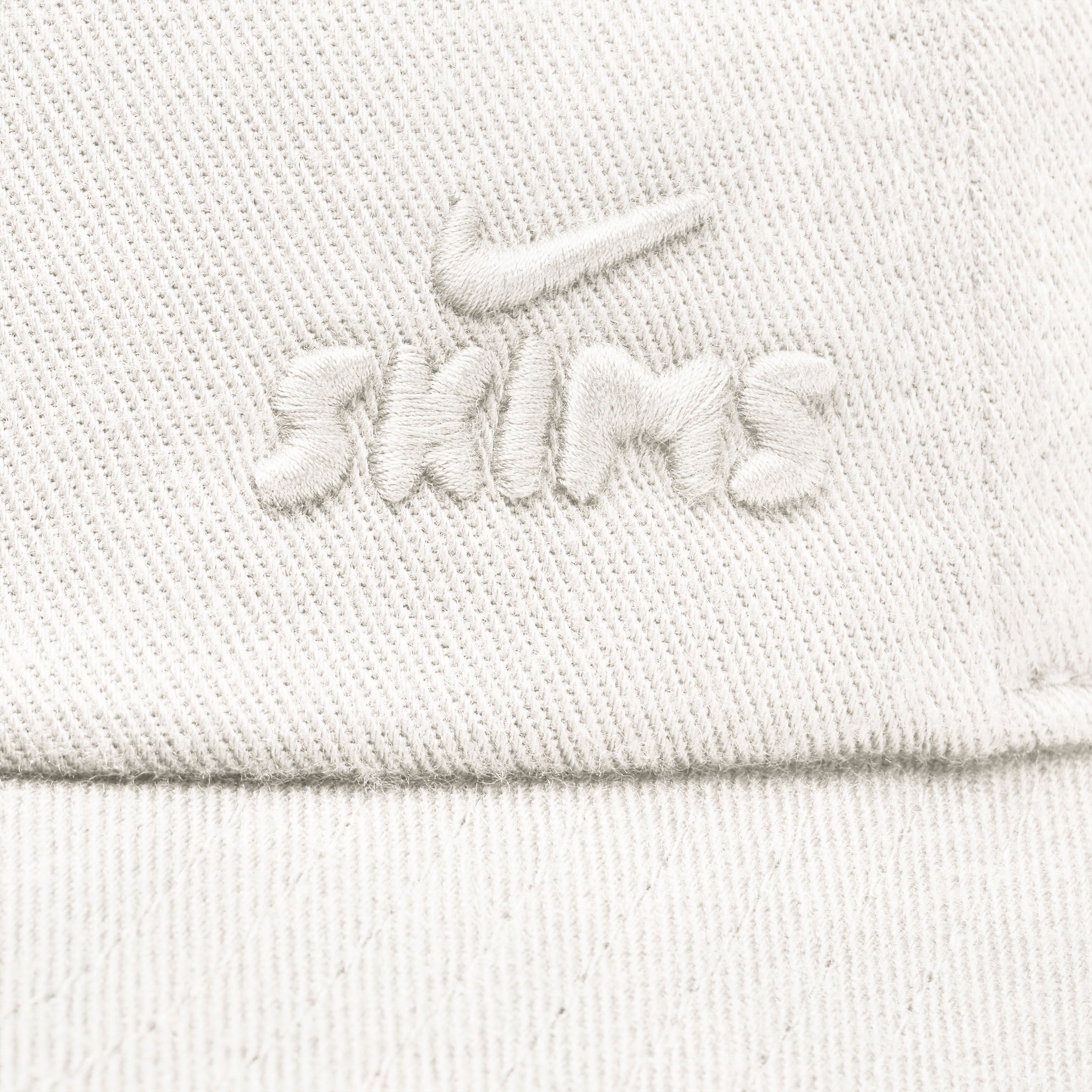 NikeSKIMS ACCESSORIES CLUB CAP | IVORYLAYS FLAT ON A WHITE BACKGROUND