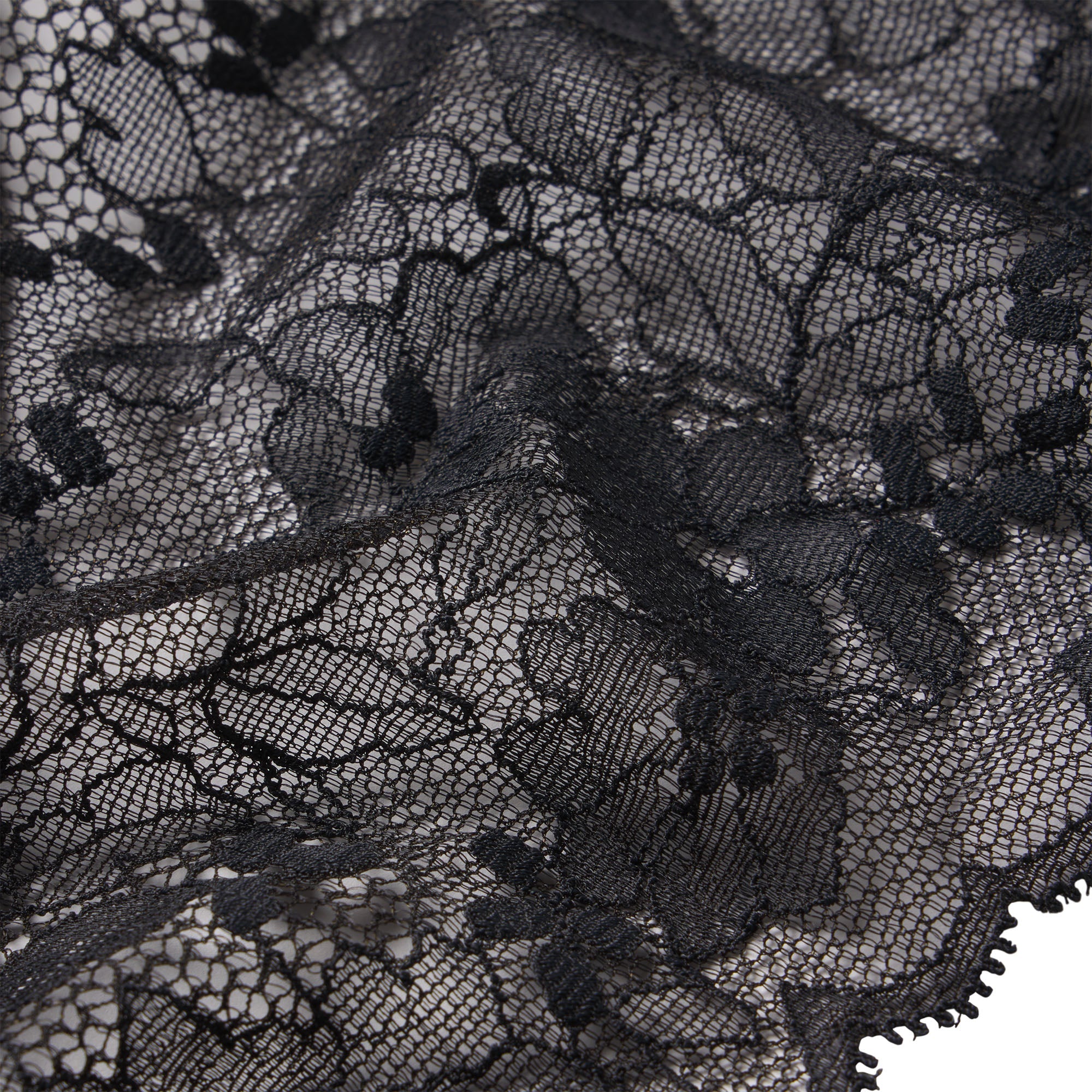SKIMS LACE THONG | ONYX ON A MODEL FRONT VIEW @ | FOCUS: 0.0, 1.0, 0.9