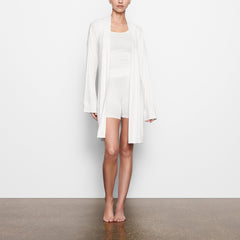 WORN BY A MODEL IN SIDE VIEW SOFT LOUNGE ROBE