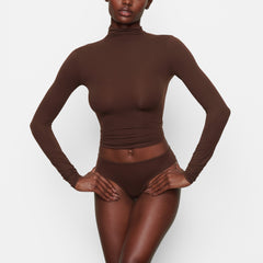 FITS EVERYBODY TURTLENECK TOP WORN BY A MODEL IN FRONT VIEW