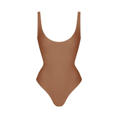 SKIMS BODY SCOOP LOW BACK THONG BODYSUIT | JASPER FLAT ON A WHITE BACKGROUND | FLT