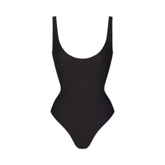 SKIMS BODY SCOOP LOW BACK THONG BODYSUIT | ONYX FLAT ON A WHITE BACKGROUND | FLT