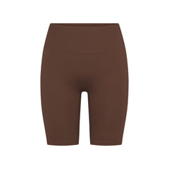 NikeSKIMS MATTE 7" BIKER SHORT | DARK SEPIA FLAT ON A WHITE BACKGROUND | FLT