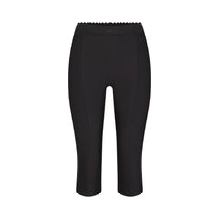 SKIMS BODY HIGH-WAISTED CAPRI | ONYX FLAT ON A WHITE BACKGROUND | FLT