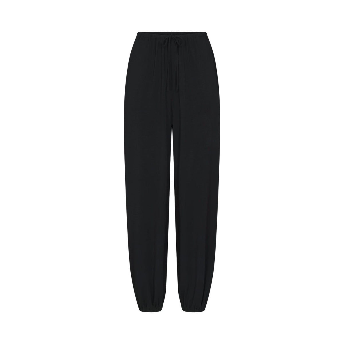 SKIMS SLEEP JOGGER | ONYX FLAT ON A WHITE BACKGROUND | FLT