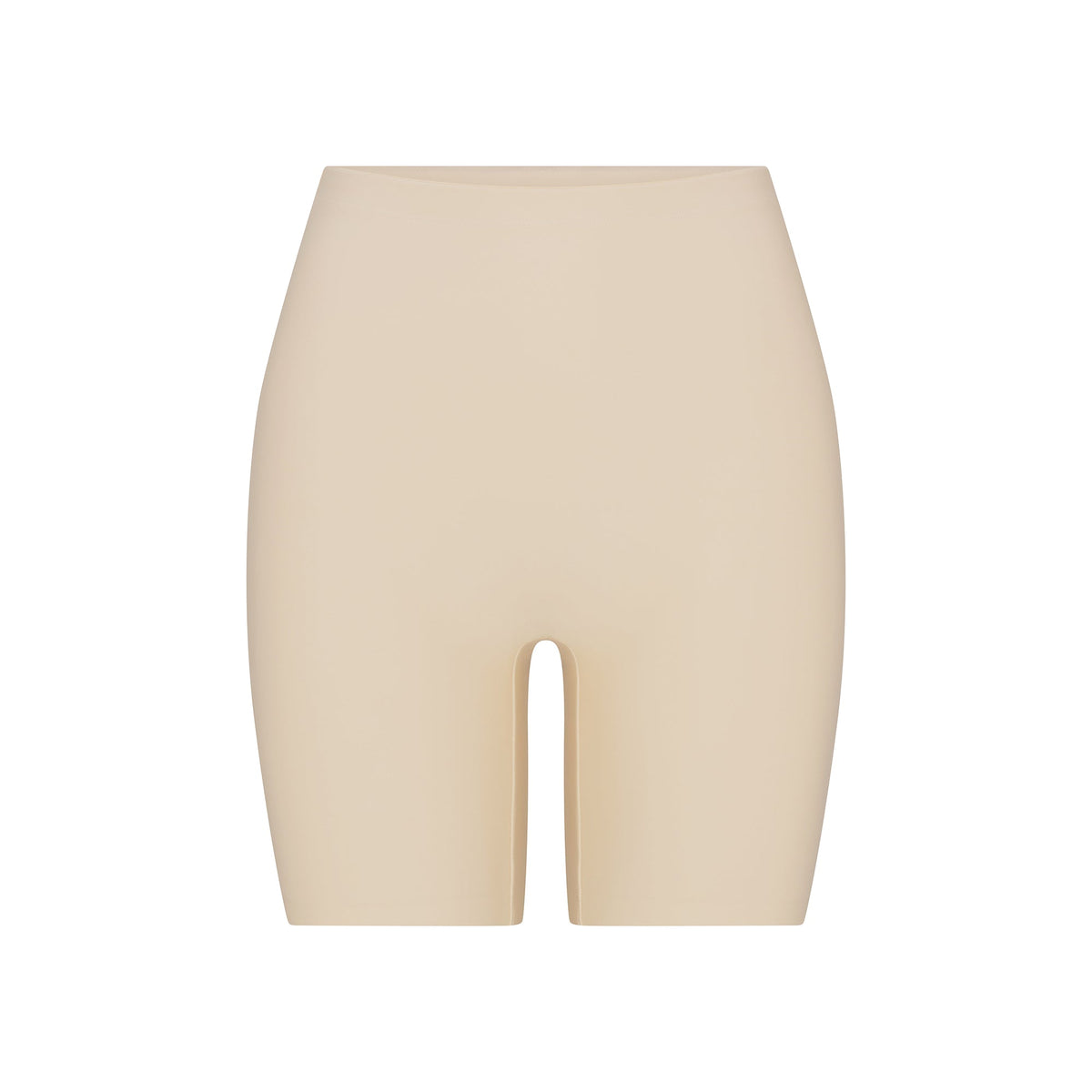 SKIMS BODY BUTT ENHANCING PADDED SHORT | SAND FLAT ON A WHITE BACKGROUND | FLT | FLT